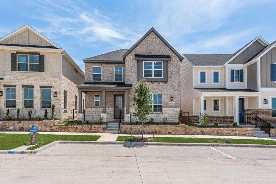 Front exterior of a new home in Bayside, Rowlett, TX, highlighting curb appeal (Image 21). Front exterior of a new home in Bayside, Rowlett, TX, highlighting curb appeal (Image 21).