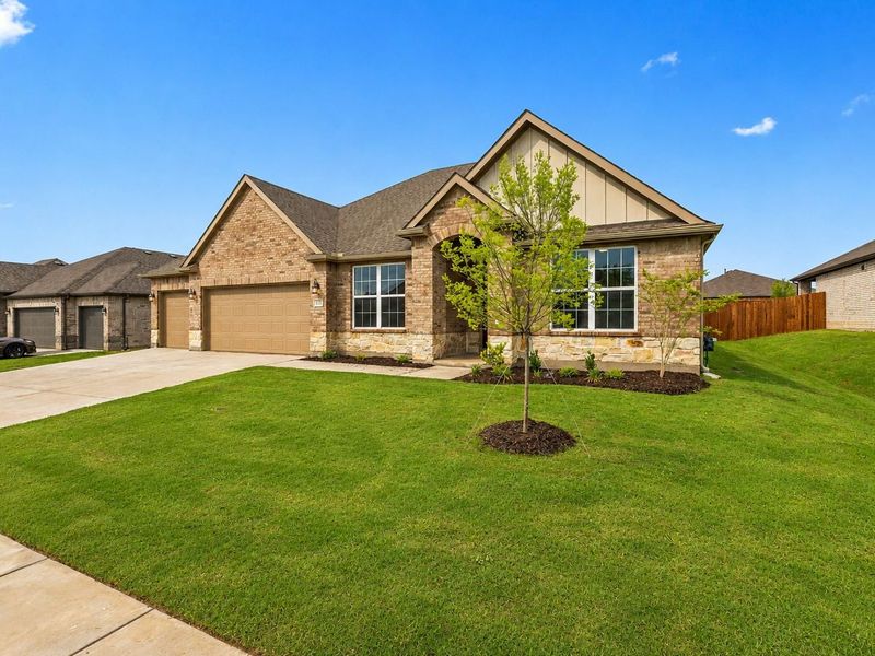 Front exterior of a new home in Waverly Estates, Josephine, TX, highlighting curb appeal (Image 18). Front exterior of a new home in Waverly Estates, Josephine, TX, highlighting curb appeal (Image 18).