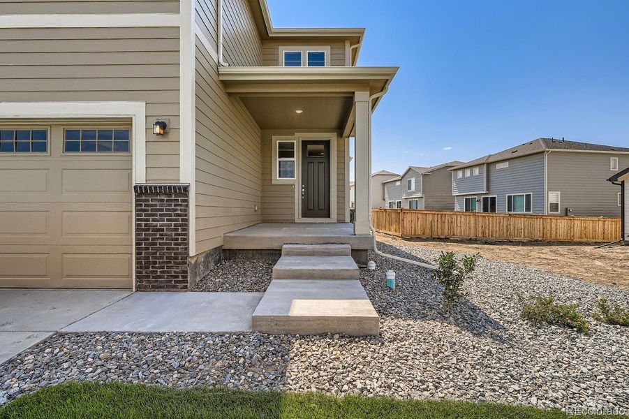Exterior details and patio area of a home in Buffalo Highlands – Commerce City, Commerce City (Image 3).