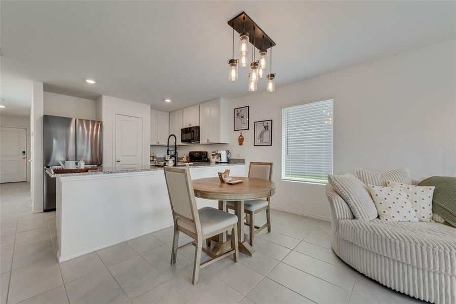 Dining room with light tile patterned floors and recessed lighting Dining room with light tile patterned floors and recessed lighting