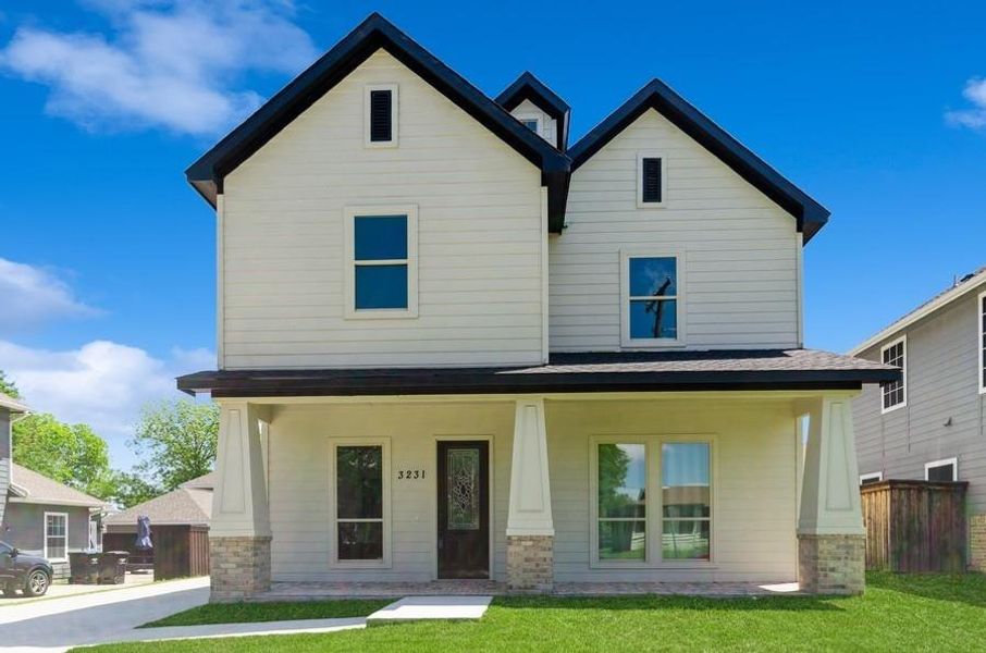 View of front of house with a porch and a front lawn