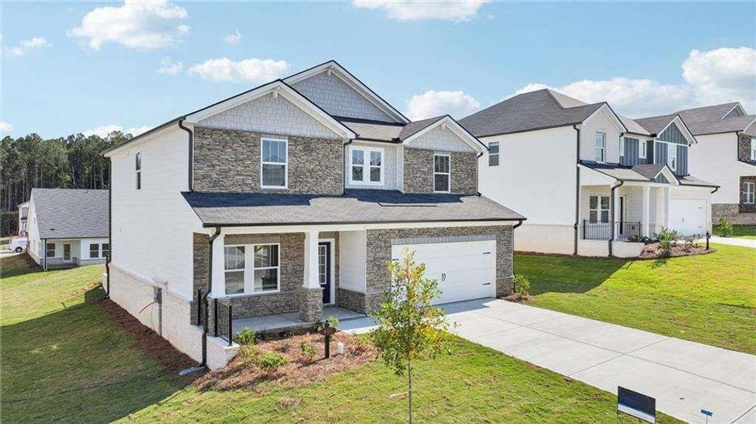 Front exterior of a new home in Parkside at Grayson, Grayson, GA, highlighting curb appeal (Image 2).