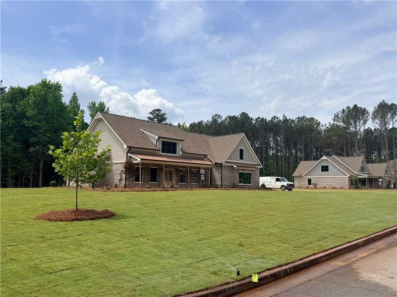 Front exterior of a new home in St. Regis, Oxford, GA, highlighting curb appeal (Image 3).