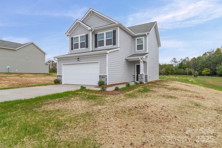 Front exterior of a new home in , Statesville, NC, highlighting curb appeal (Image 19).
