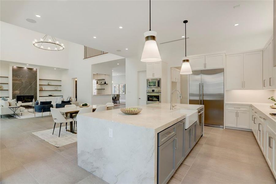 The Kitchen also features all Italian Fulgor Milano Professional Series stainless-steel appliances, DXV white farmhouse sink with polished nickel faucet, Quartz prep countertops, built-in trash and spice drawers, under and above cabinet accent lighting, hidden under-cabinet outlets and a spacious walk-in pantry.