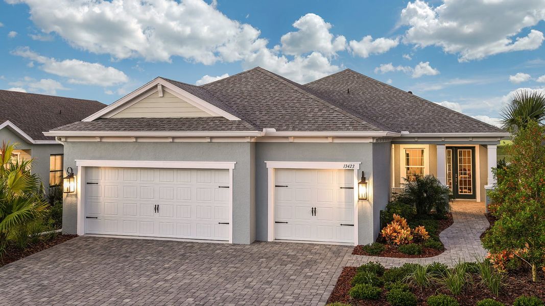 Front exterior of a new home in Canoe Creek, Parrish, FL, highlighting curb appeal (Image 21).