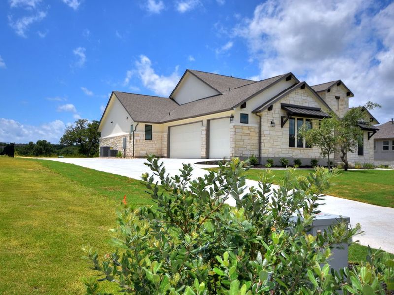 Representative exterior photo of a completed home built from the San Simeon I by Giddens Homes in Clearwater Ranch, Liberty Hill, TX (Image 36).