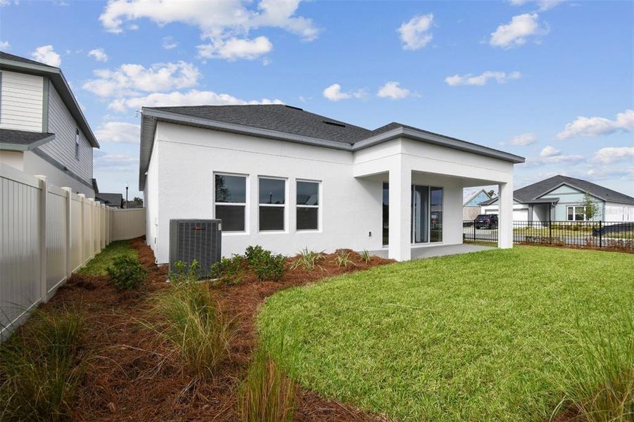Exterior details and patio area of a home in Oakfield at Mount Dora Village Series, Mount Dora (Image 20).
