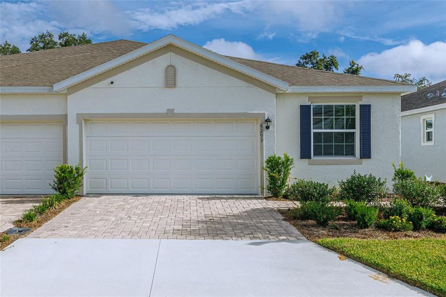 Front exterior of a new home in Ocala Preserve, Ocala, FL, highlighting curb appeal (Image 21).