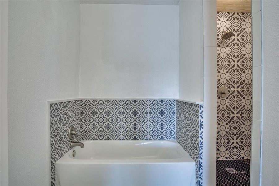 Full bathroom featuring a garden tub Full bathroom featuring a garden tub