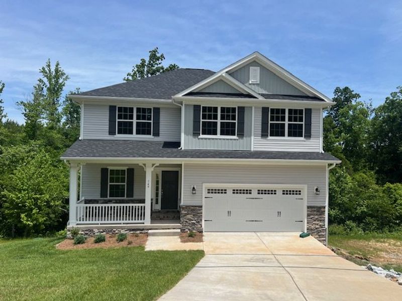 Front exterior of a new home in Northlake, Statesville, NC, highlighting curb appeal (Image 1). Front exterior of a new home in Northlake, Statesville, NC, highlighting curb appeal (Image 1).