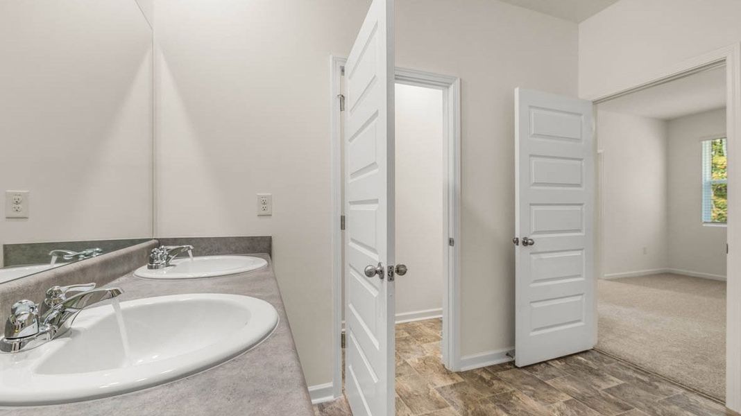 Representative furnished interior of a home built from the Dennis by D.R. Horton in Glenmaye, Hampton (Image 10).