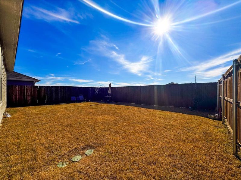 View of fenced backyard