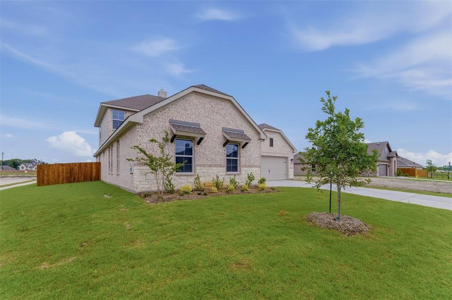 Front exterior of a new home in Cedar Ridge Estates, Anna, TX, highlighting curb appeal (Image 19).
