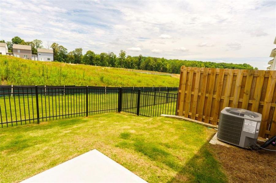 Exterior details and patio area of a home in Rolling Meadows, Jasper (Image 27).