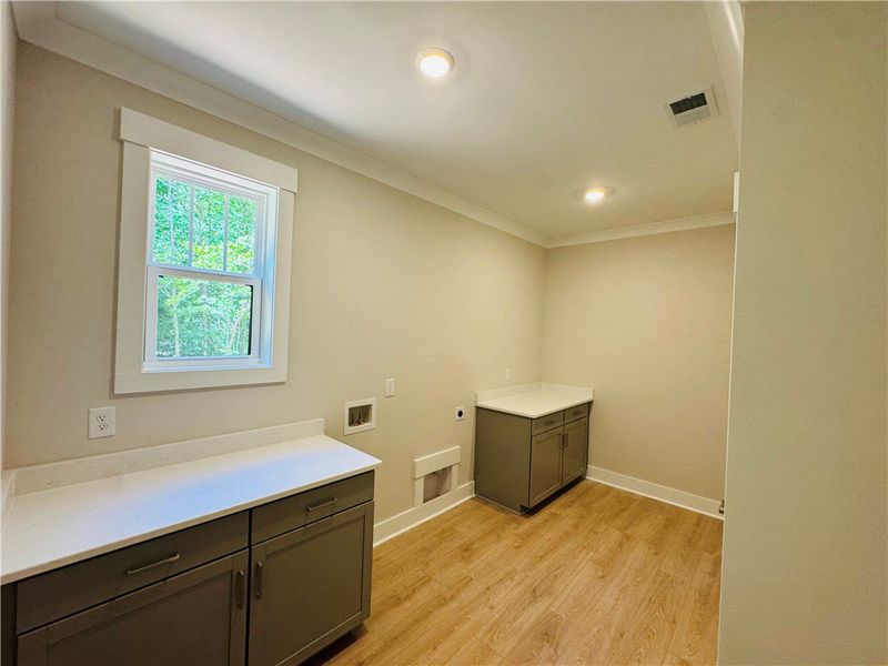 This spacious utility room offers practical storag