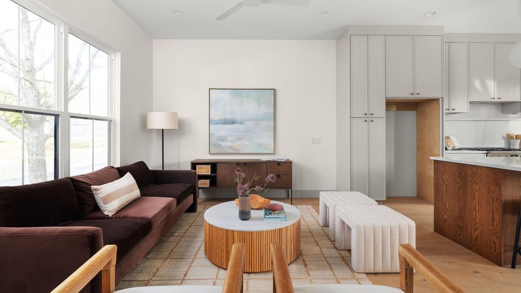 Living room with ceiling fan and recessed lighting