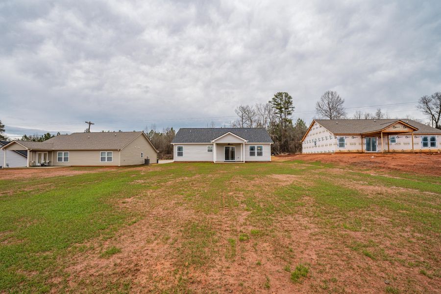 Representative exterior photo of a completed home built from the Saxon by Enchanted Homes in Huckleberry Cove, Chesnee, SC (Image 28). Representative exterior photo of a completed home built from the Saxon by Enchanted Homes in Huckleberry Cove, Chesnee, SC (Image 28).