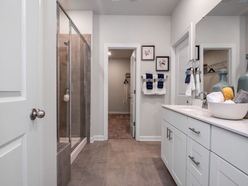 The primary bath offers dual vanity sinks.