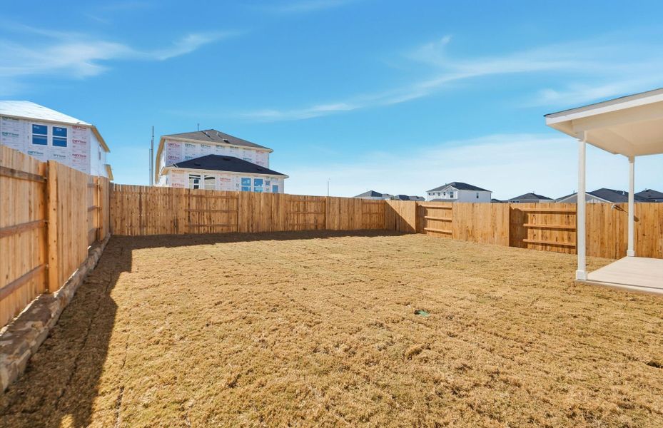 Exterior details and patio area of a home in Sunfield, Buda (Image 24).