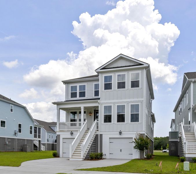 Front exterior of a new home in Miller's Crossing, Johns Island, SC, highlighting curb appeal (Image 2). Front exterior of a new home in Miller's Crossing, Johns Island, SC, highlighting curb appeal (Image 2).