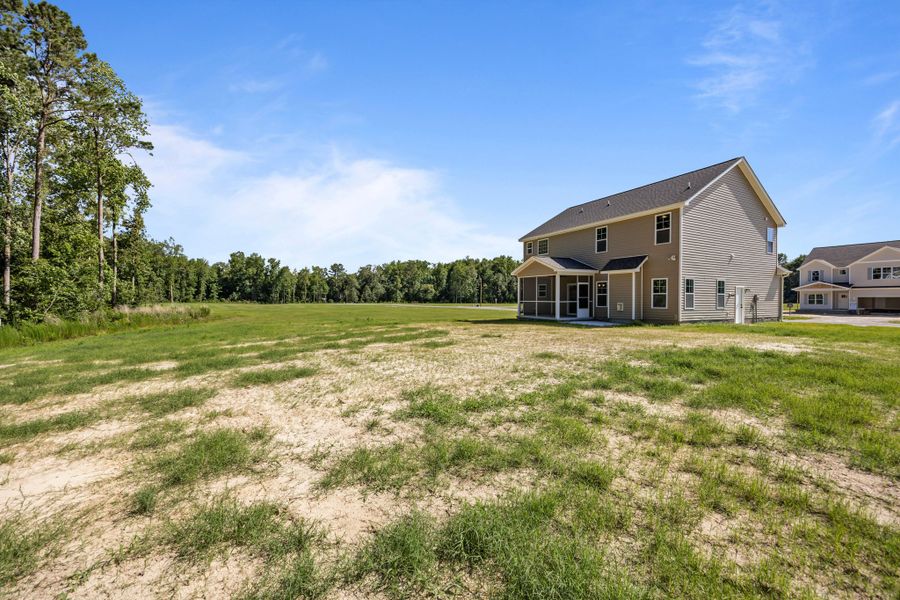 Front exterior of a new home in Laurel Oaks, Greenville, NC, highlighting curb appeal (Image 35). Front exterior of a new home in Laurel Oaks, Greenville, NC, highlighting curb appeal (Image 35).