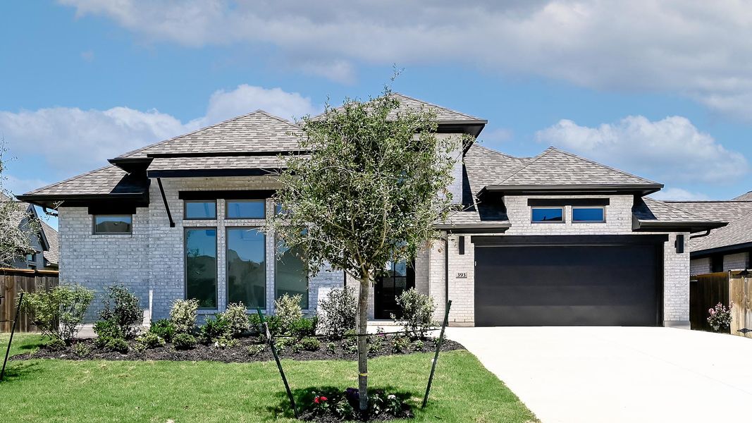 Front exterior of a new home in 6 Creeks, Kyle, TX, highlighting curb appeal (Image 1). Front exterior of a new home in 6 Creeks, Kyle, TX, highlighting curb appeal (Image 1).