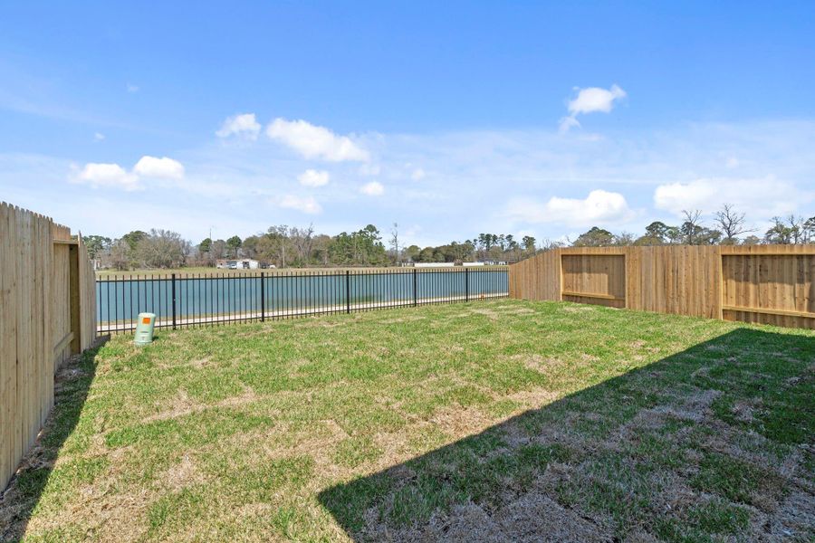 Exterior details and patio area of a home in Cypresswood Landing, Humble (Image 22).