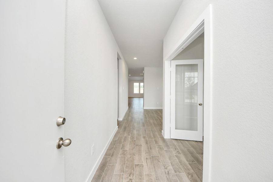 As you step into the threshold of this luxurious home, you'll soon be welcomed by an elegant glass door (to be installed). Inside, soaring ceilings amplify the spaciousness, while the refined wood-look tile flooring and oversized baseboards exude sophistication and charm. As you step into the threshold of this luxurious home, you'll soon be welcomed by an elegant glass door (to be installed). Inside, soaring ceilings amplify the spaciousness, while the refined wood-look tile flooring and oversized baseboards exude sophistication and charm.