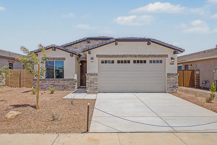 Front exterior of a new home in Avanti at Granite Vista, Waddell, AZ, highlighting curb appeal (Image 21). Front exterior of a new home in Avanti at Granite Vista, Waddell, AZ, highlighting curb appeal (Image 21).