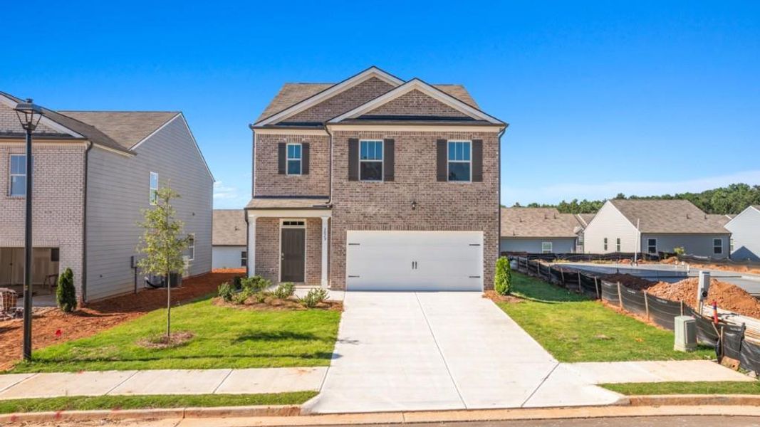 Front exterior of a new home in Pointe Park, Union City, GA, highlighting curb appeal (Image 1). Front exterior of a new home in Pointe Park, Union City, GA, highlighting curb appeal (Image 1).