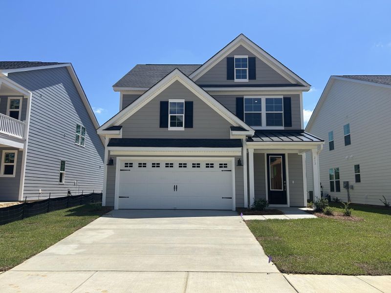 Front exterior of a new home in Pineland Preserve, Summerville, SC, highlighting curb appeal (Image 1). Front exterior of a new home in Pineland Preserve, Summerville, SC, highlighting curb appeal (Image 1).