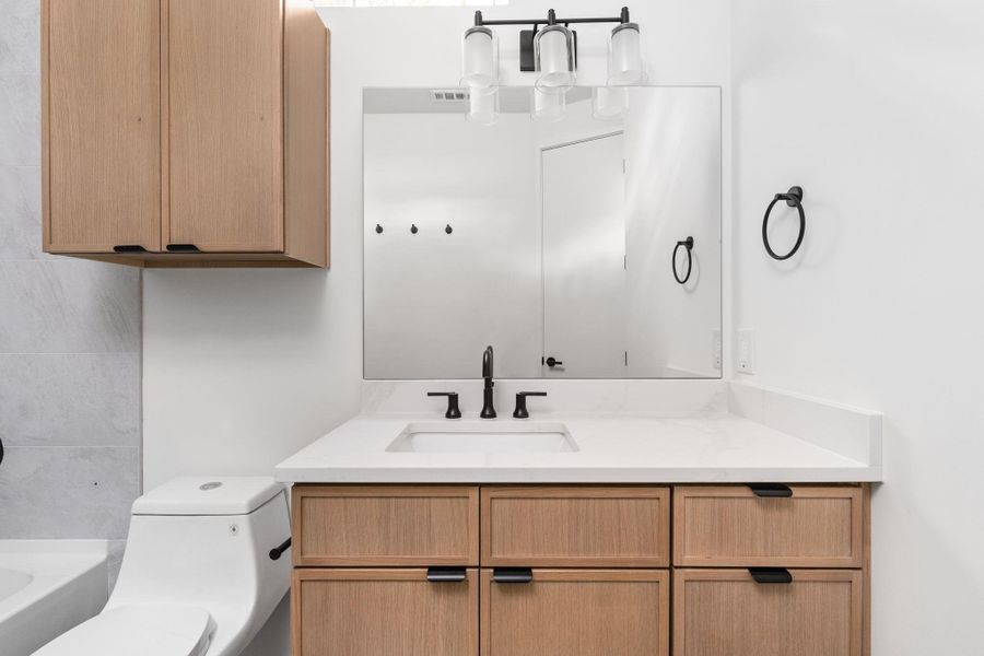 Bathroom featuring vanity and toilet Bathroom featuring vanity and toilet