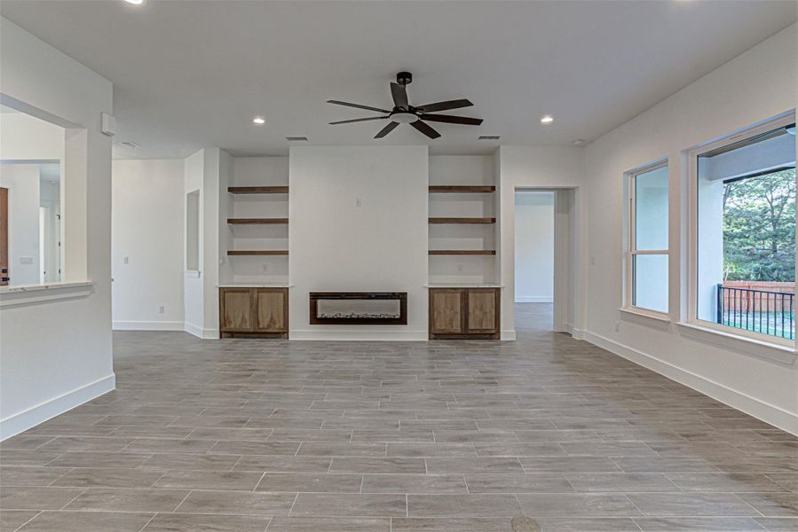 Electric fireplace framed with built in shelves Electric fireplace framed with built in shelves