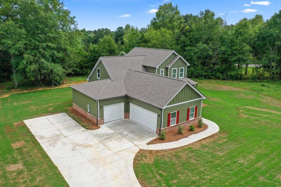 Front exterior of a new home in , McDonough, GA, highlighting curb appeal (Image 16).