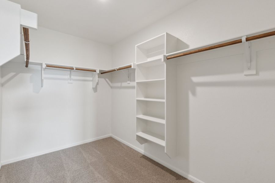 Primary Closet in the Hayden home plan by Trophy Signature Homes – REPRESENTATIVE PHOTO