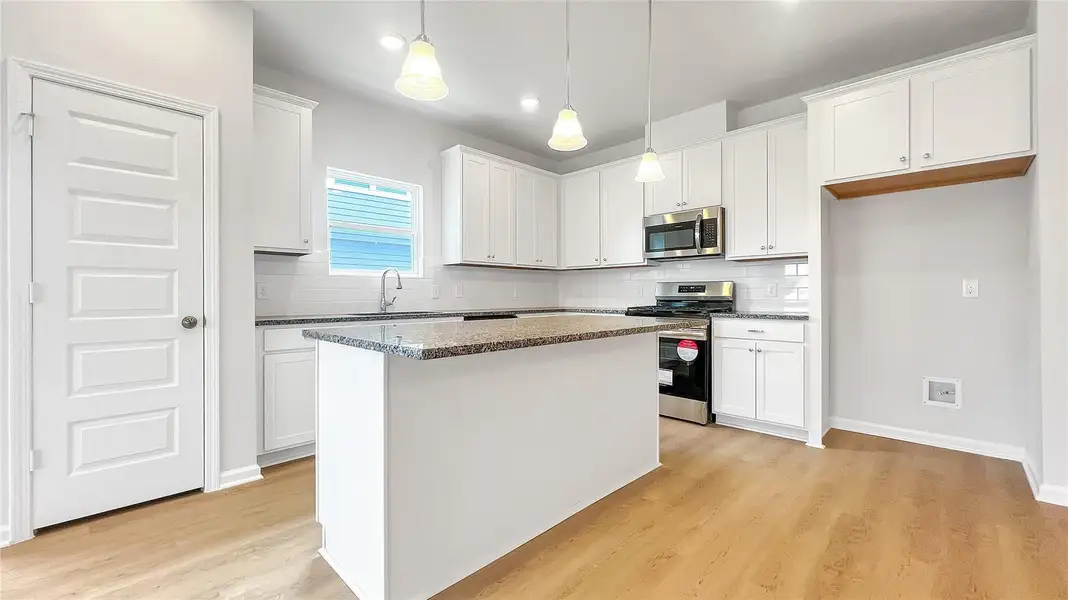 The Pearson- Kitchen.Home under construction. Sample floor plan photo used for illustrative purposes only. Upgrades, selections options, windows and colors may vary.