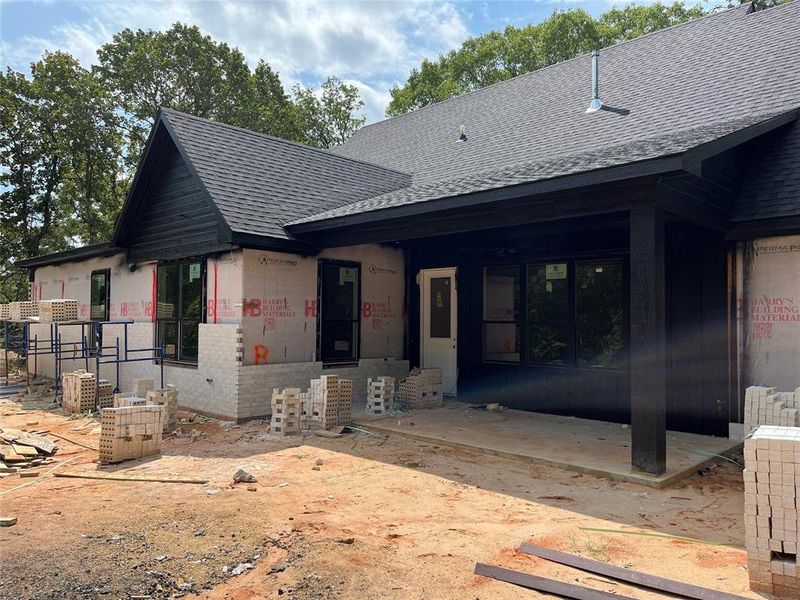 Covered back porch on slab with cedar columns Covered back porch on slab with cedar columns