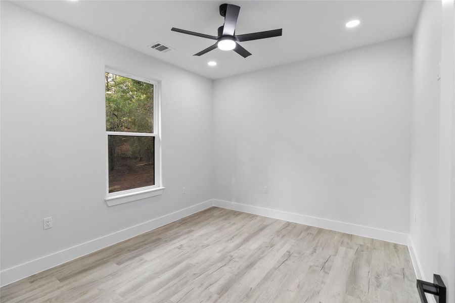 Spare room with light wood-type flooring, recessed lighting, and a ceiling fan
