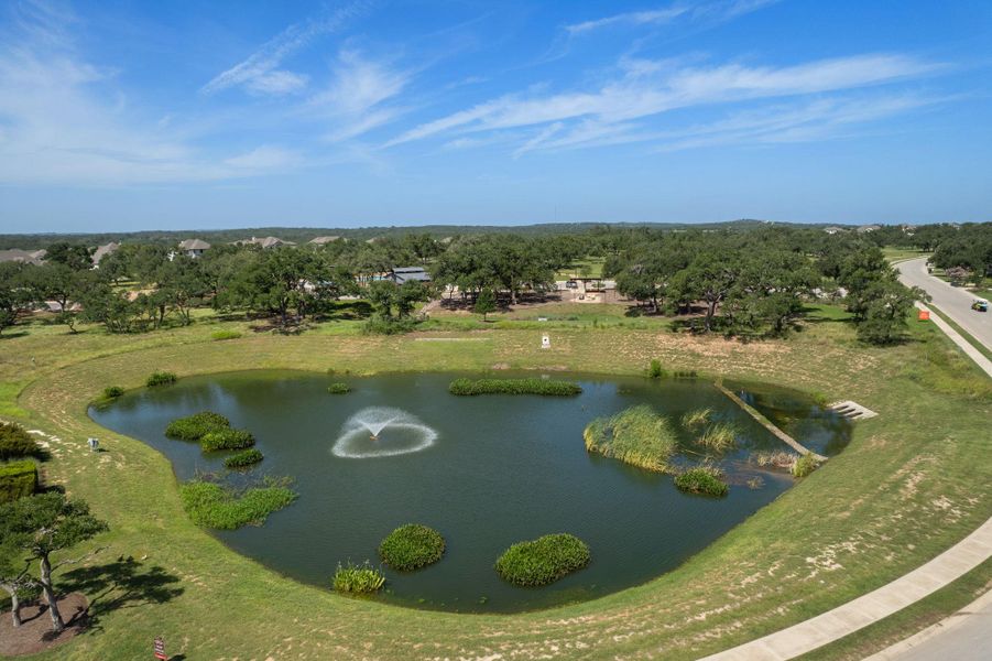 Drone / aerial view of a tree filled landscape and a large body of water Drone / aerial view of a tree filled landscape and a large body of water