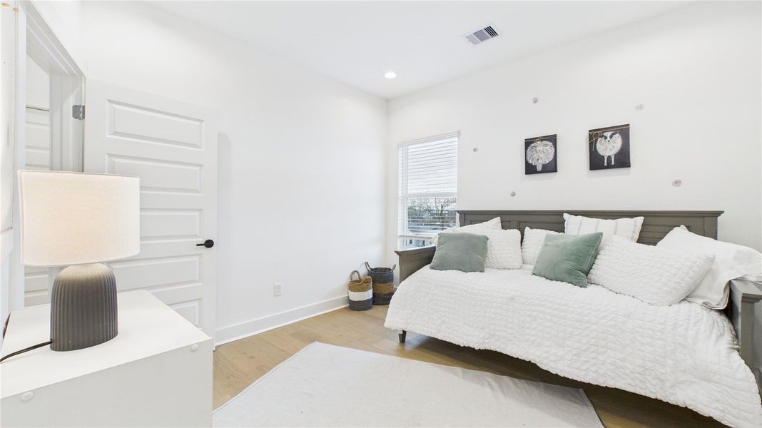 The second secondary bedroom on the third floor offers ample space and includes a private ensuite full bathroom, providing comfort and privacy in a well-appointed setting.