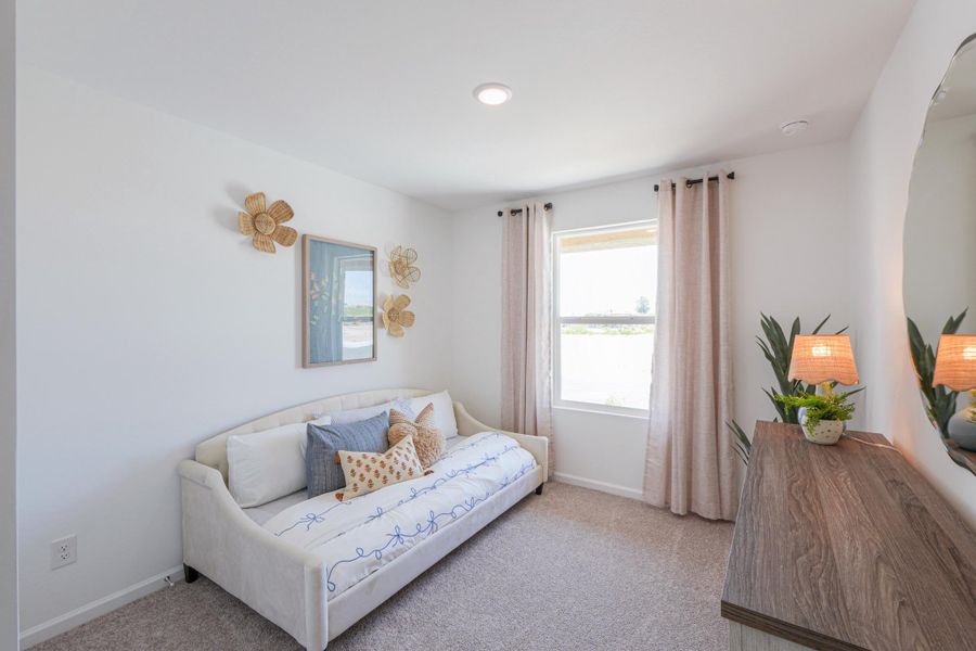 A living room with a white couch.