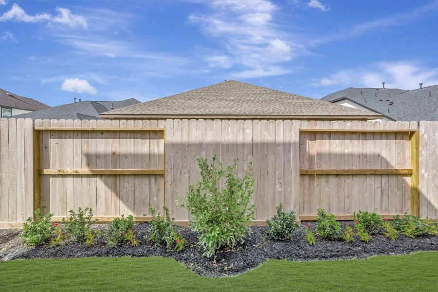Lush landscaping in the backyard Lush landscaping in the backyard
