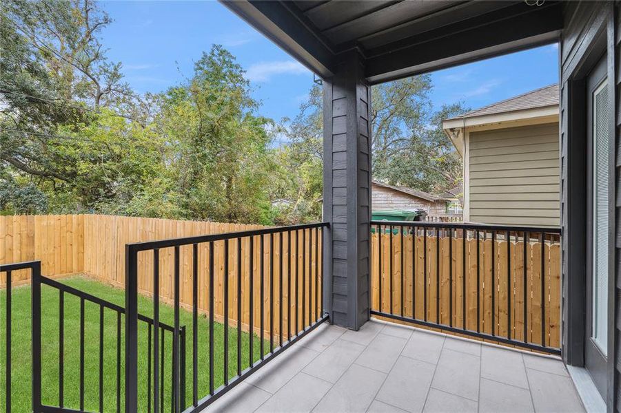 Step outside to your private balcony, with a clear view of the landscaped backyard, offering a tranquil space for morning coffee or evening relaxation.