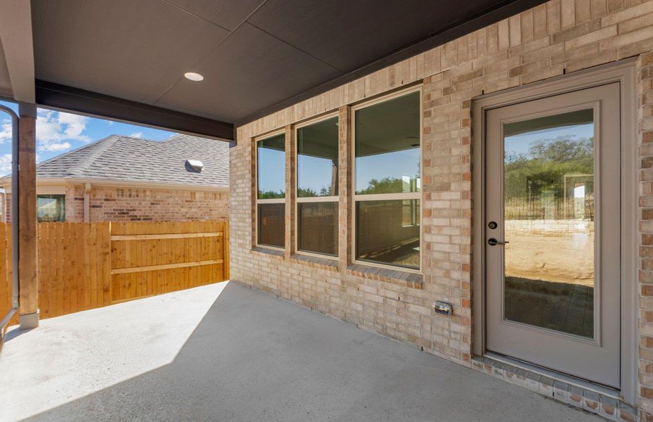 Exterior details and patio area of a home in West Cypress Hills, Spicewood (Image 2).