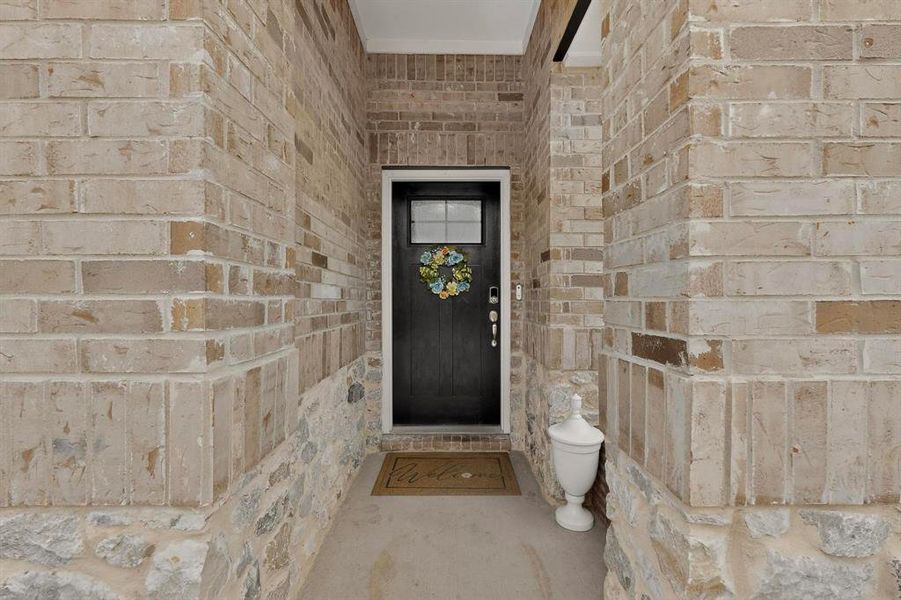 Exterior details and patio area of a home in Wolf Creek Farms - Signature Series, Melissa (Image 3).
