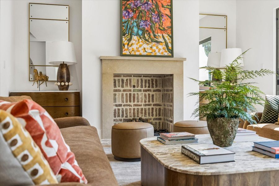 Gas log fireplace with custom designed limestone mantel and hand-laid brick firebox Gas log fireplace with custom designed limestone mantel and hand-laid brick firebox