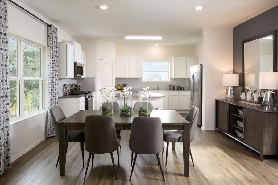 Dining space featuring light wood-style floors and recessed lighting