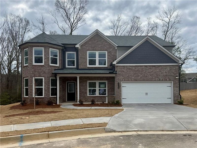 Front exterior of a new home in , Buford, GA, highlighting curb appeal (Image 1). Front exterior of a new home in , Buford, GA, highlighting curb appeal (Image 1).