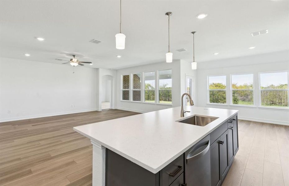 Large island overlooking gathering room and dining areas Large island overlooking gathering room and dining areas